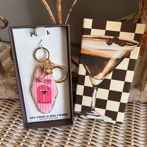 Piper K brand keychain and bag charm features a pink striped espresso martini